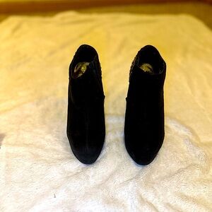 Forever 21, Black high heeled boots with brass rivets on the back of each boot.